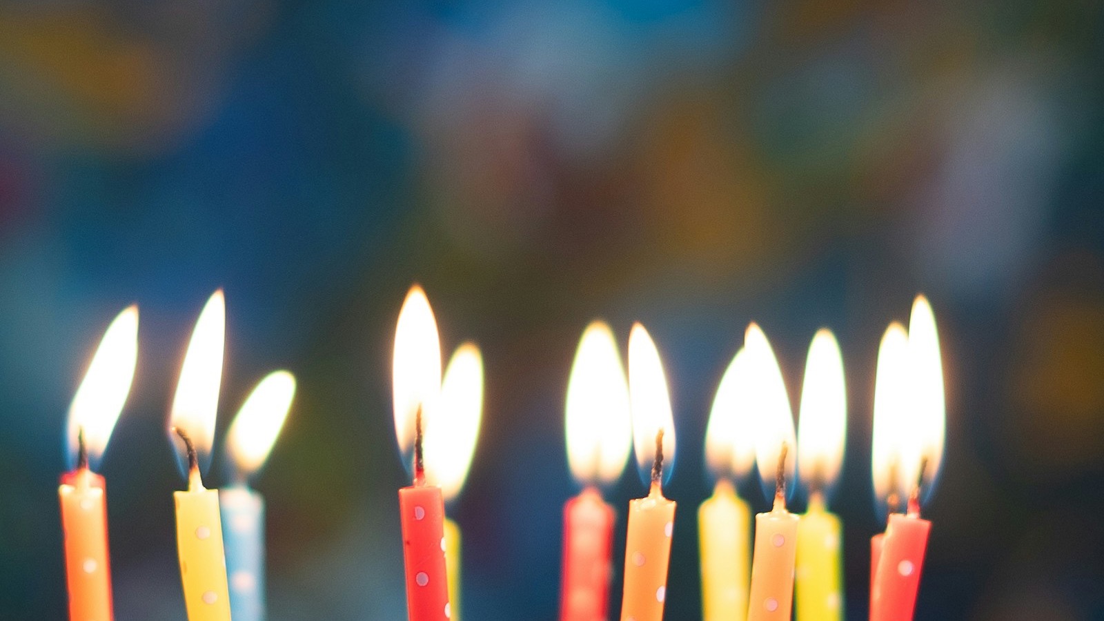 Birthday cake with lit candles for a personalized song for wife