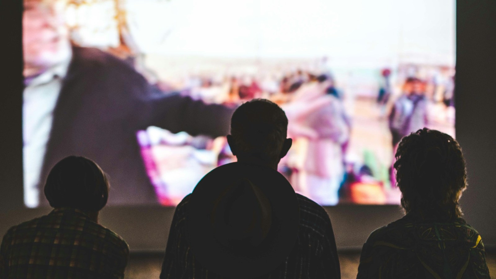 People watching video content on a large screen